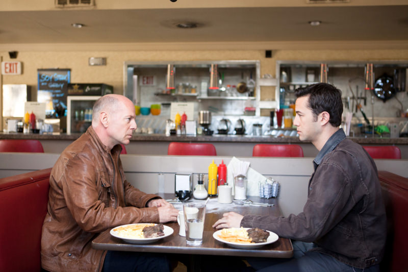 Bruce Willis and Joseph Gordon-Levitt as "Joe" in TriStar Pictures, Film District, and End Game Entertainment's action thriller LOOPER.